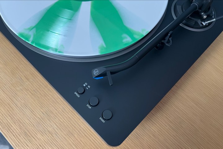 The Audio-Technica AT-LP70X turntable with a peppermint colored record on it.