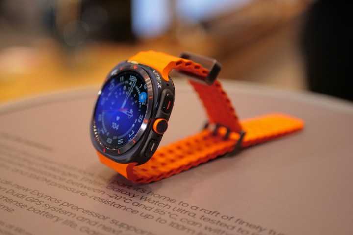 The Samsung Galaxy Watch Ultra in black with an orange strap.